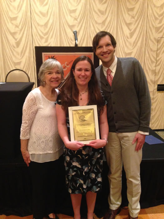 Professors holding award.