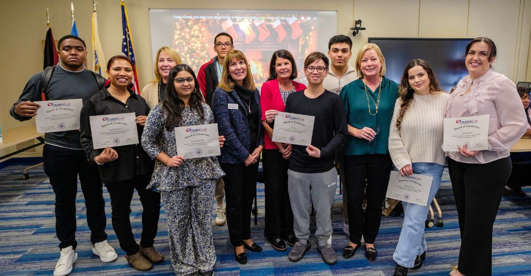 nine students receive their Award of Completion for passing the Academic English Language Program