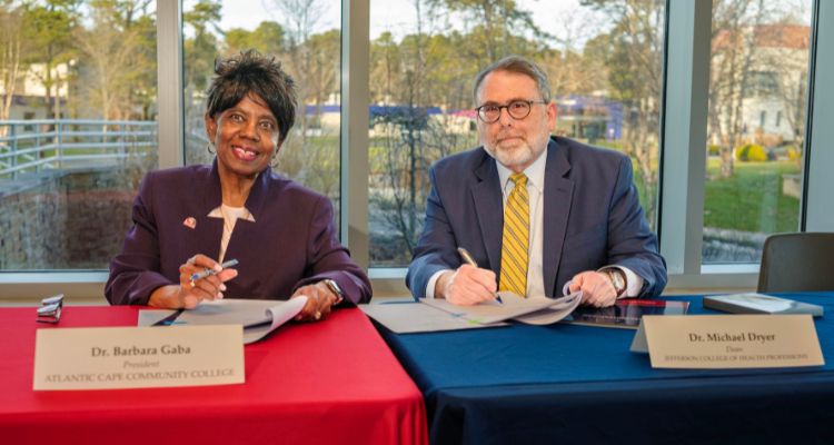Dr Barbara Gaba and Dr Michael Dryer signing off on the Atlantic Cape Thomas Jefferson University partnership agreement