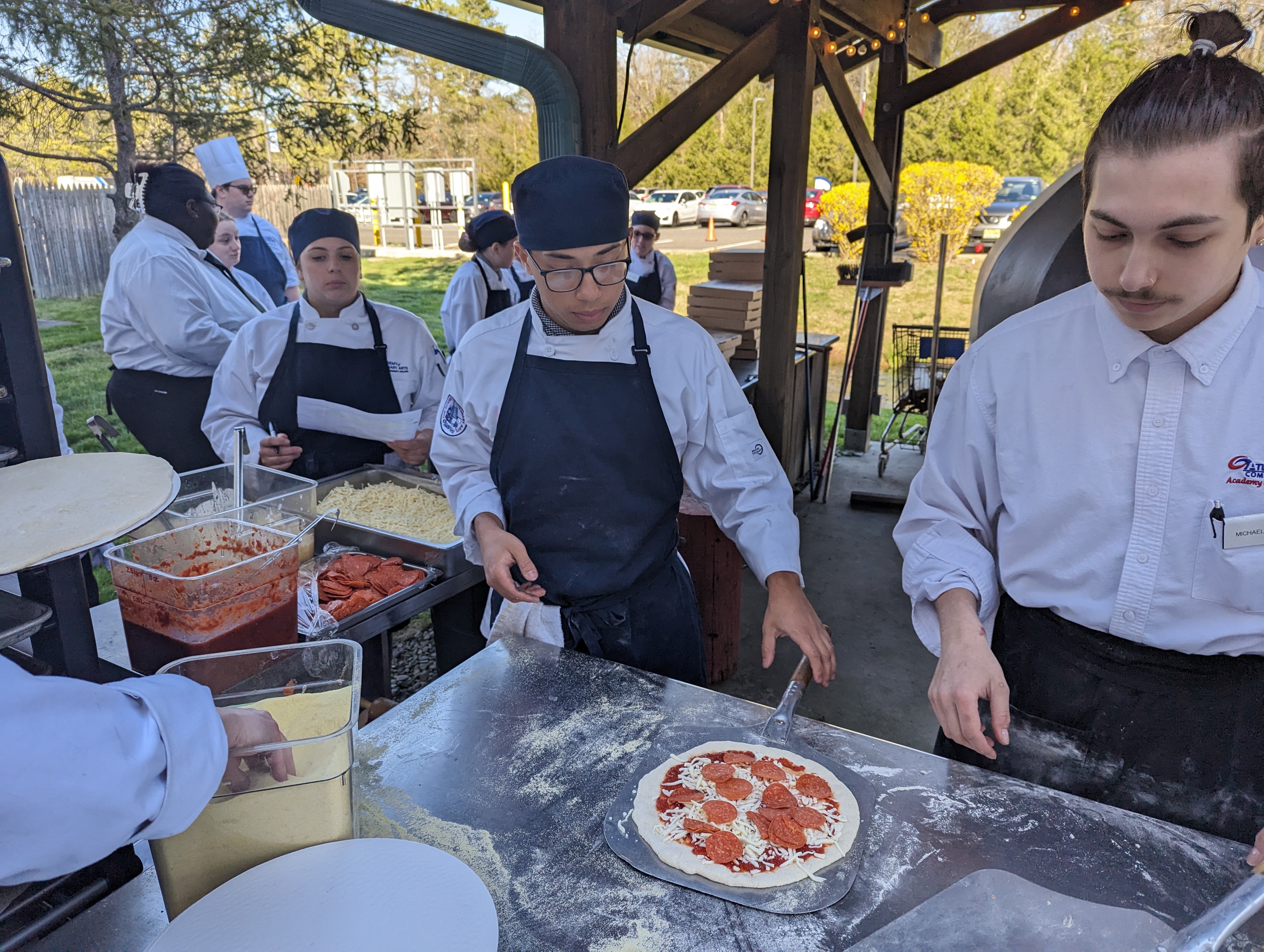 ACA students prepare fresh pizzas