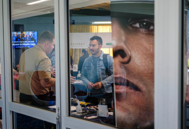 Atlantic Cape student Arturo Lopez speaks to Navy recruiter