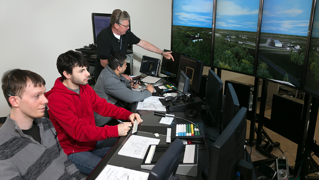 Students in an air traffic control simulator.