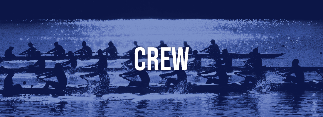 Crew members rowing on the water