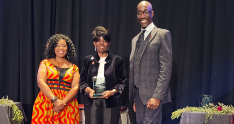 Dr. Barbara Gaba accepts a Rutgers African-American Alumni Alliance Hall of Fame award