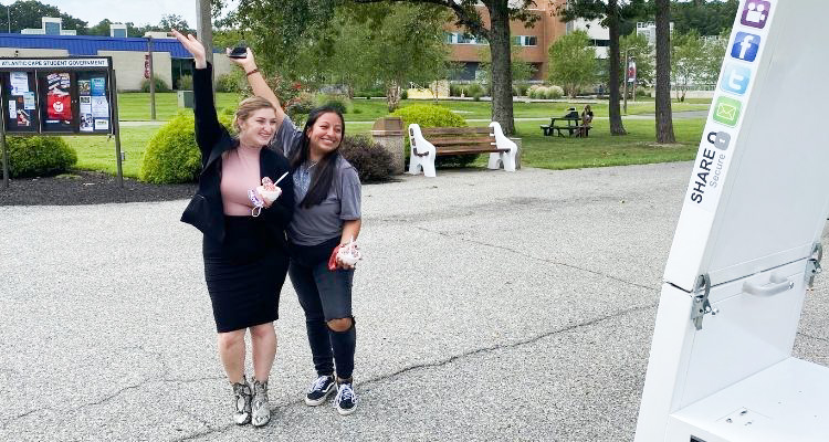  Adjunct Professor Jenna DeLuca and student Aylin Alvarez, 19, of Cape May, pose with their ice cream at the photobooth Wednesday, Sept. 8, at Atlantic Cape Community College's Welcome Back Picnic.