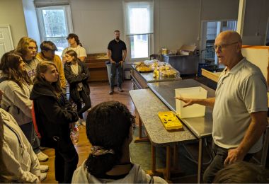 Professor David Jungblut discusses storm surge and coastal damage with students