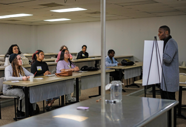 Stephanie Davies speaks to college students during the financial literacy workshop