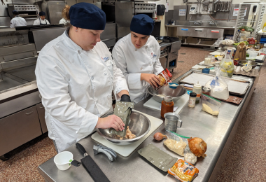 Burke and Carpenter preparing their MRE ingredients