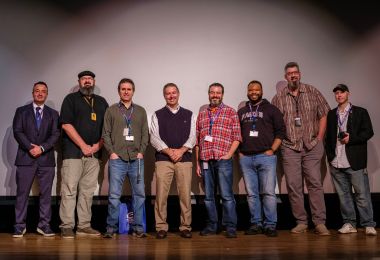 Dr. Zilovic on the left and Scott Grayson fourth from the left pose with high school teachers at Media Day