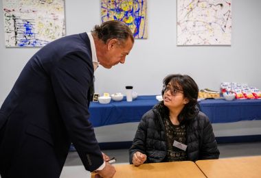 Dr. Robert Previti speaks with an Atlantic Cape scholarship recipient