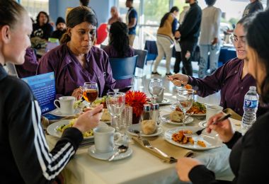 Students sitting at the high income table 