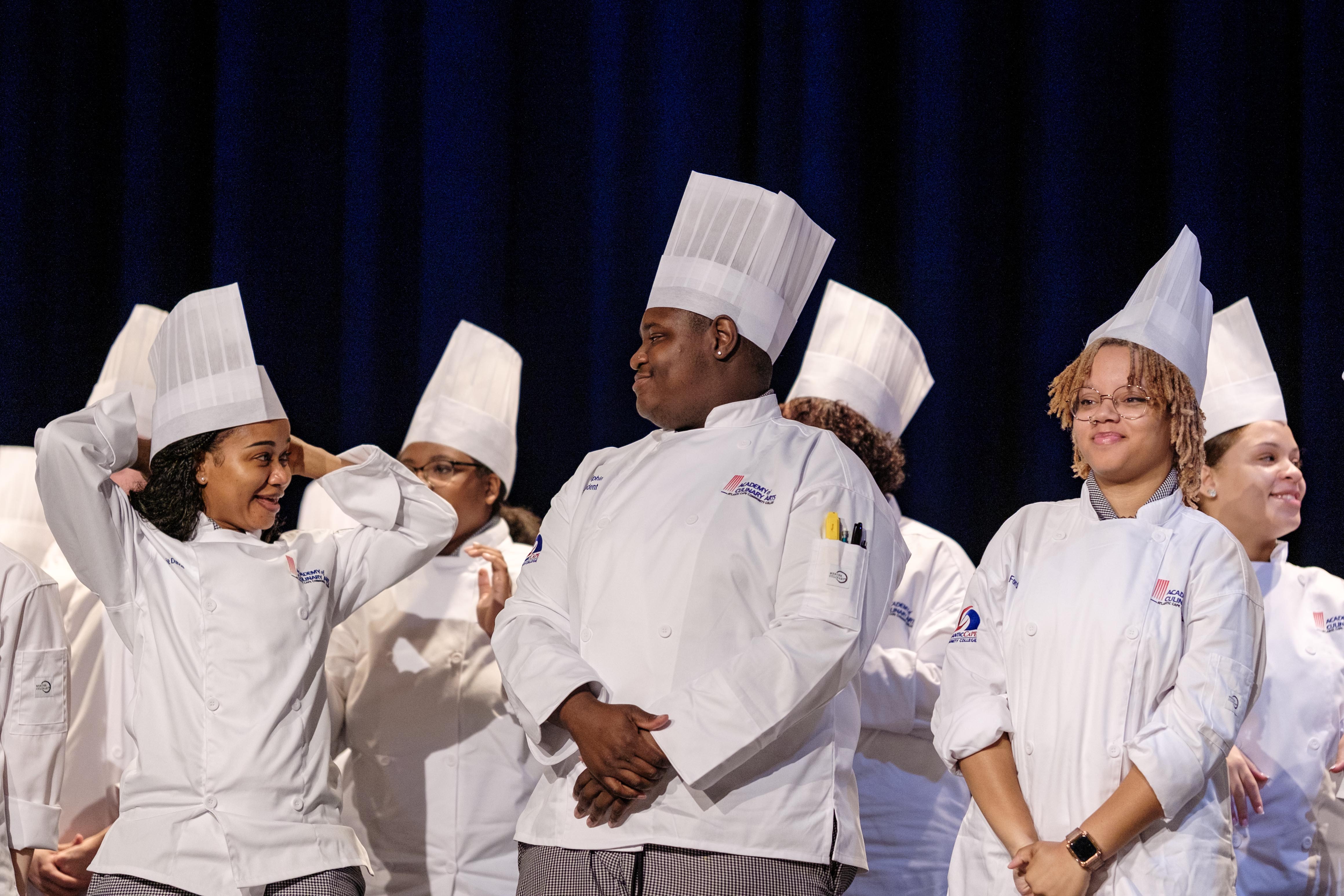 Culinary students try on their toques