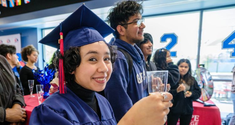 A soon to be Atlantic Cape graduate raises her glass during the toast