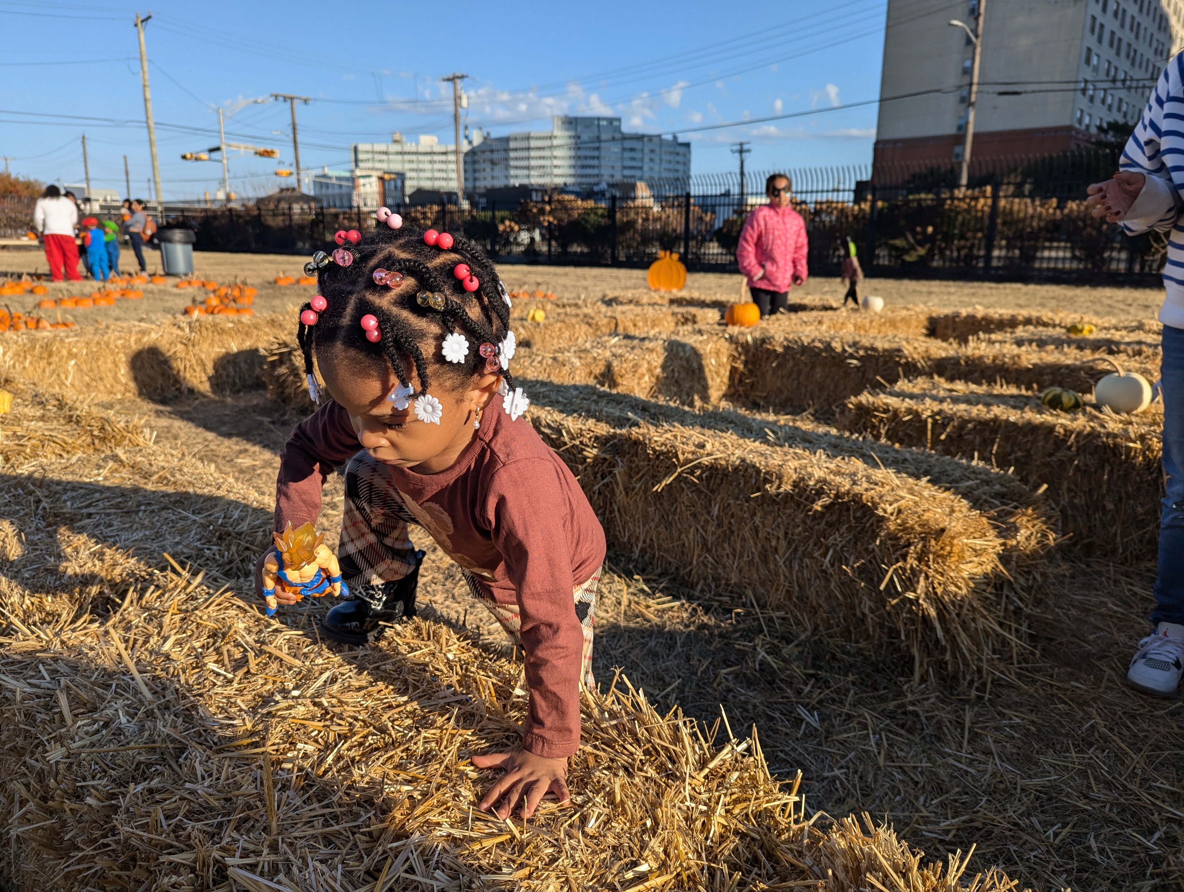 Child navigates the hay bale maze