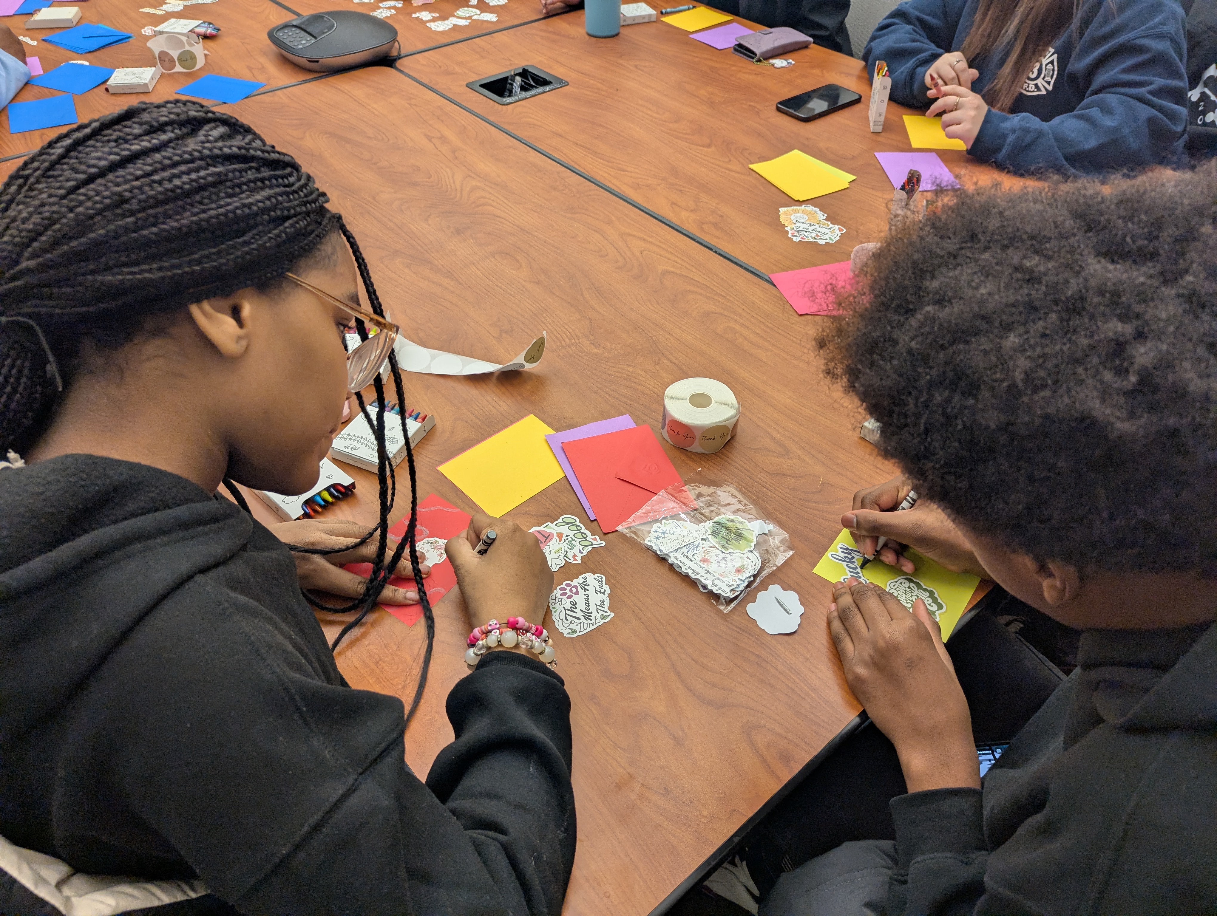 Volunteers create thank you cards for local first responders