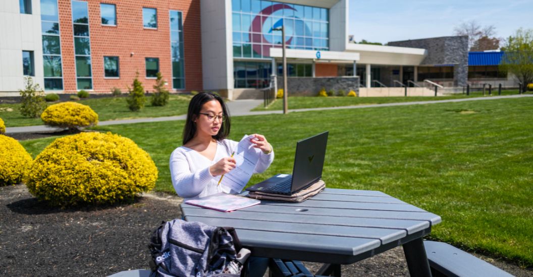 Rosalie studying in the Quad during summer