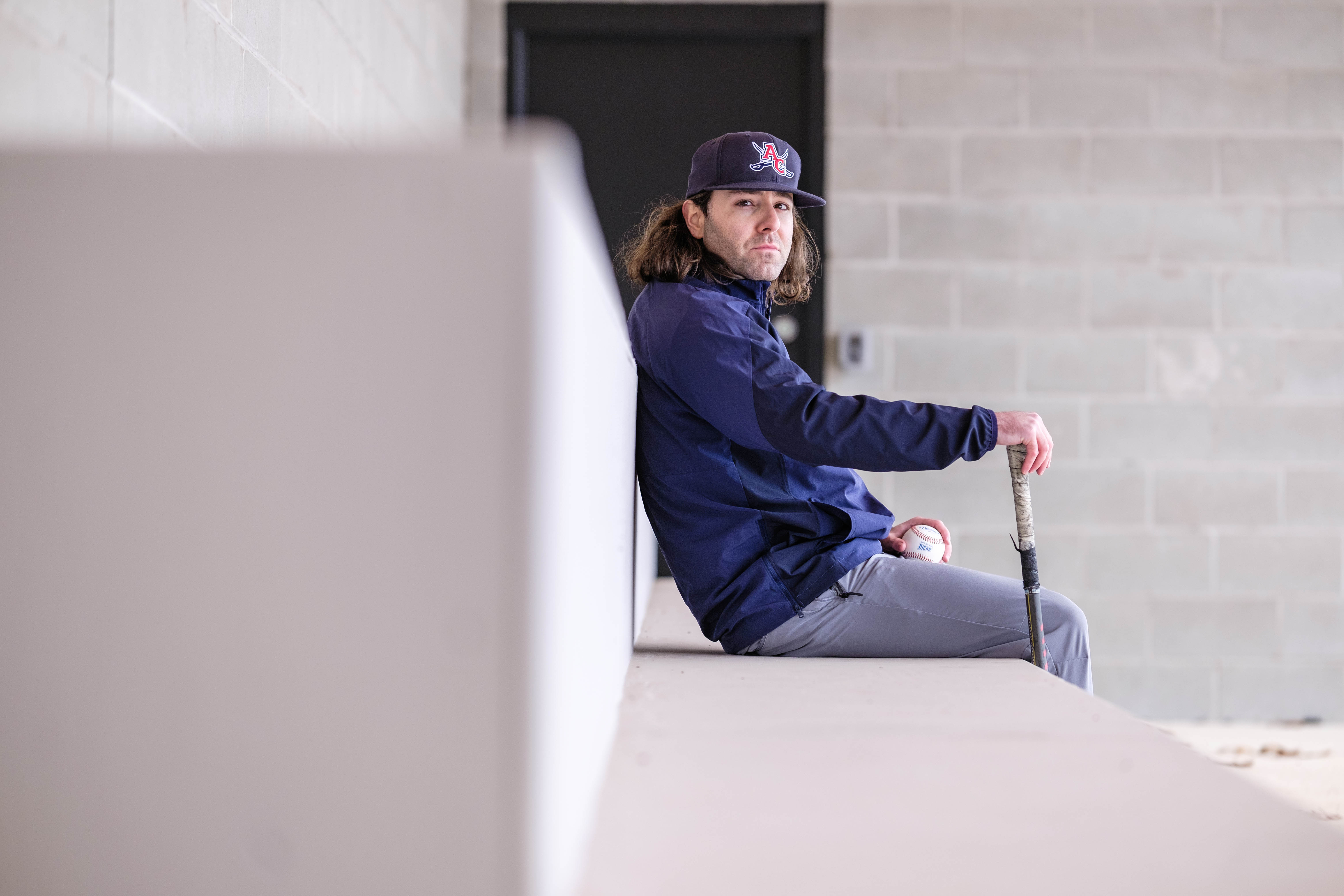 In the dugout with baseball new head coach Alex Tafaro